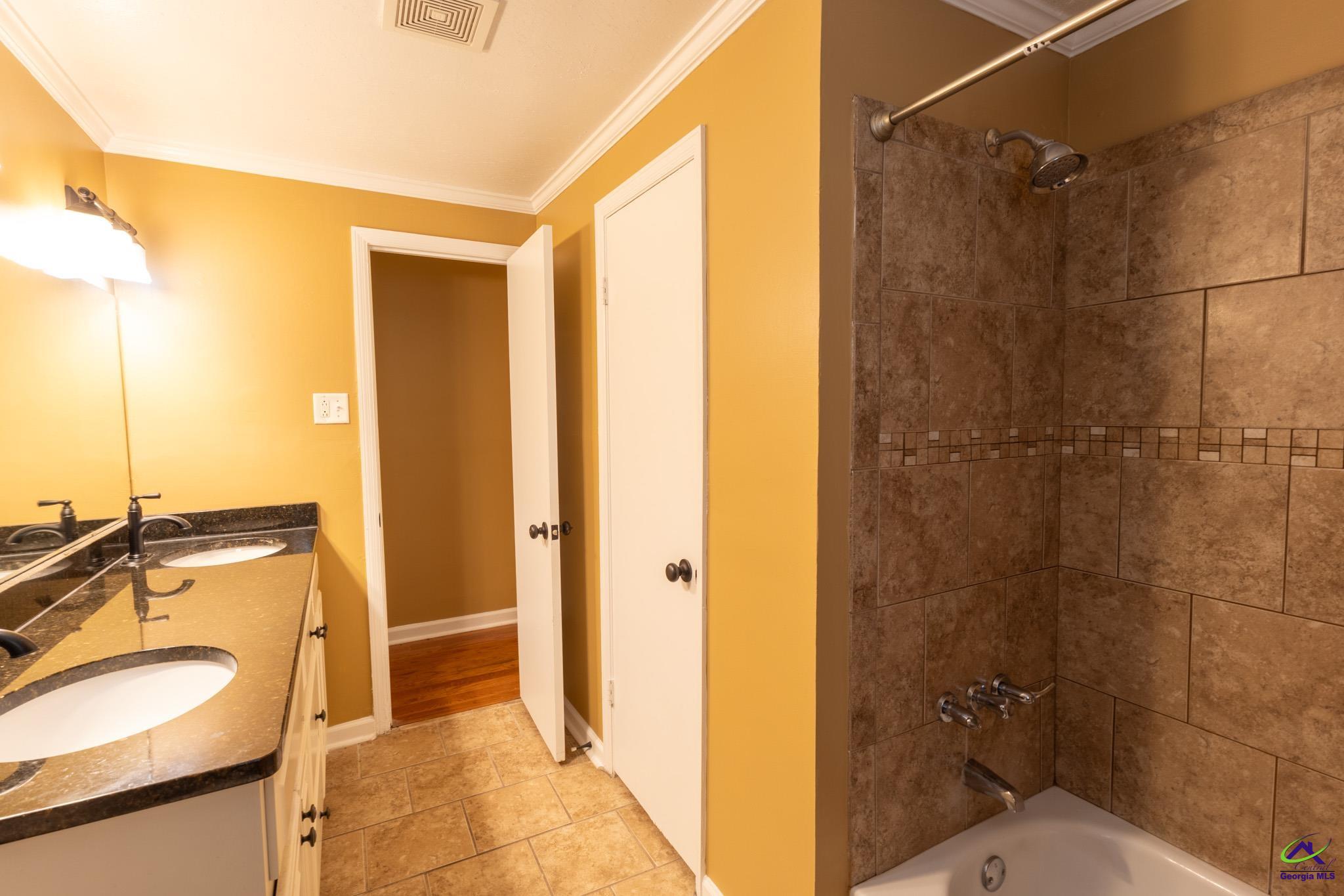 3491 Sandy Circle Macon, GA 31216 - Photo 22 of 47 a bathroom with a sink and a shower