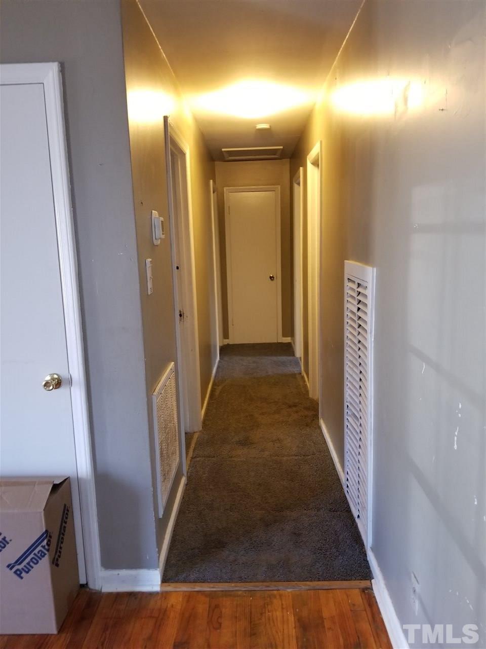 1306 Lenoir Street Raleigh, NC 27610 - Photo 4 of 7 a view of a hallway with wooden floor