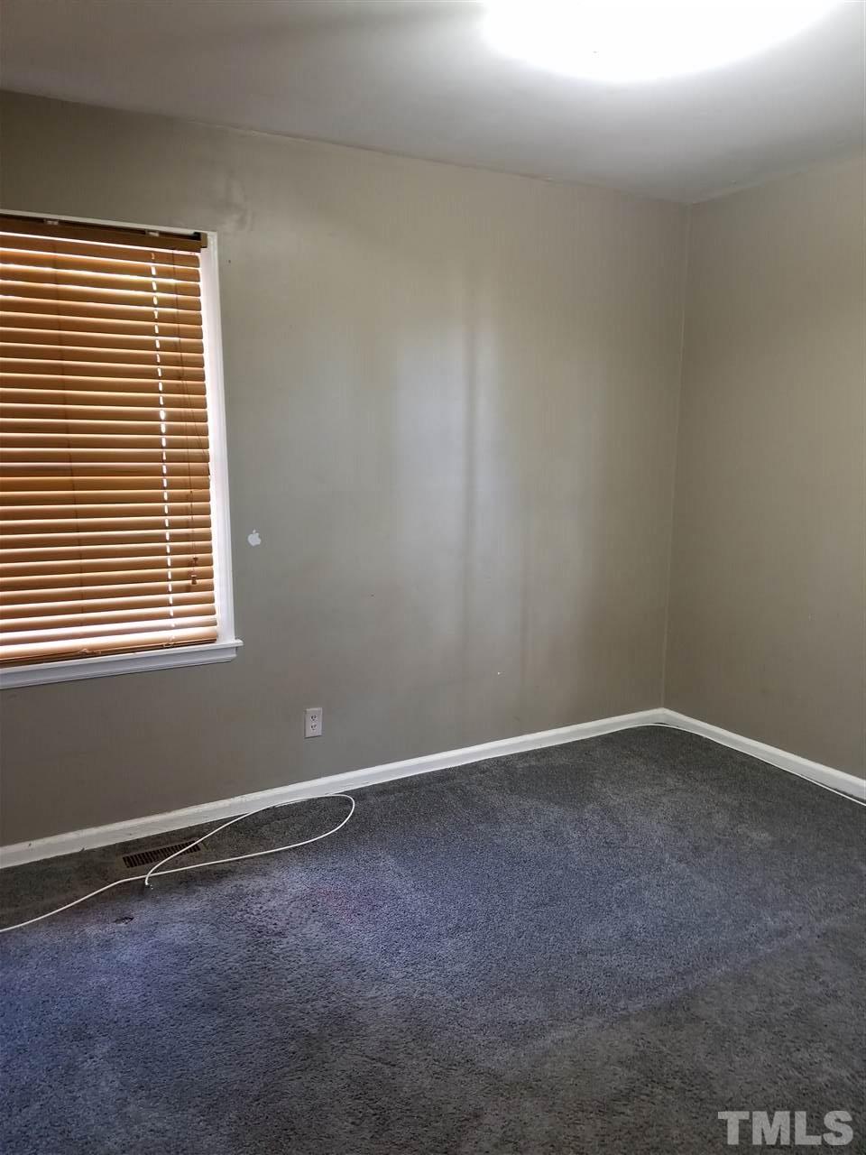 1306 Lenoir Street Raleigh, NC 27610 - Photo 6 of 7 an empty room with a window