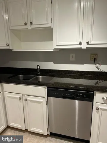 a kitchen with stainless steel appliances a refrigerator and a stove