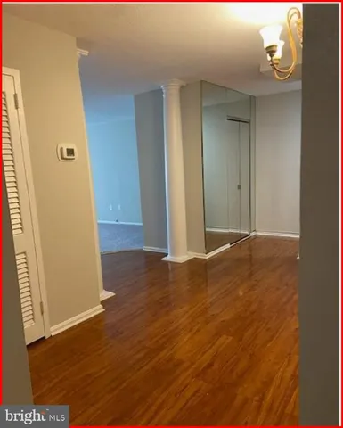 a view of a hallway with an empty room