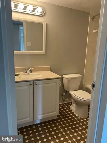 a bathroom with a toilet and a bathtub