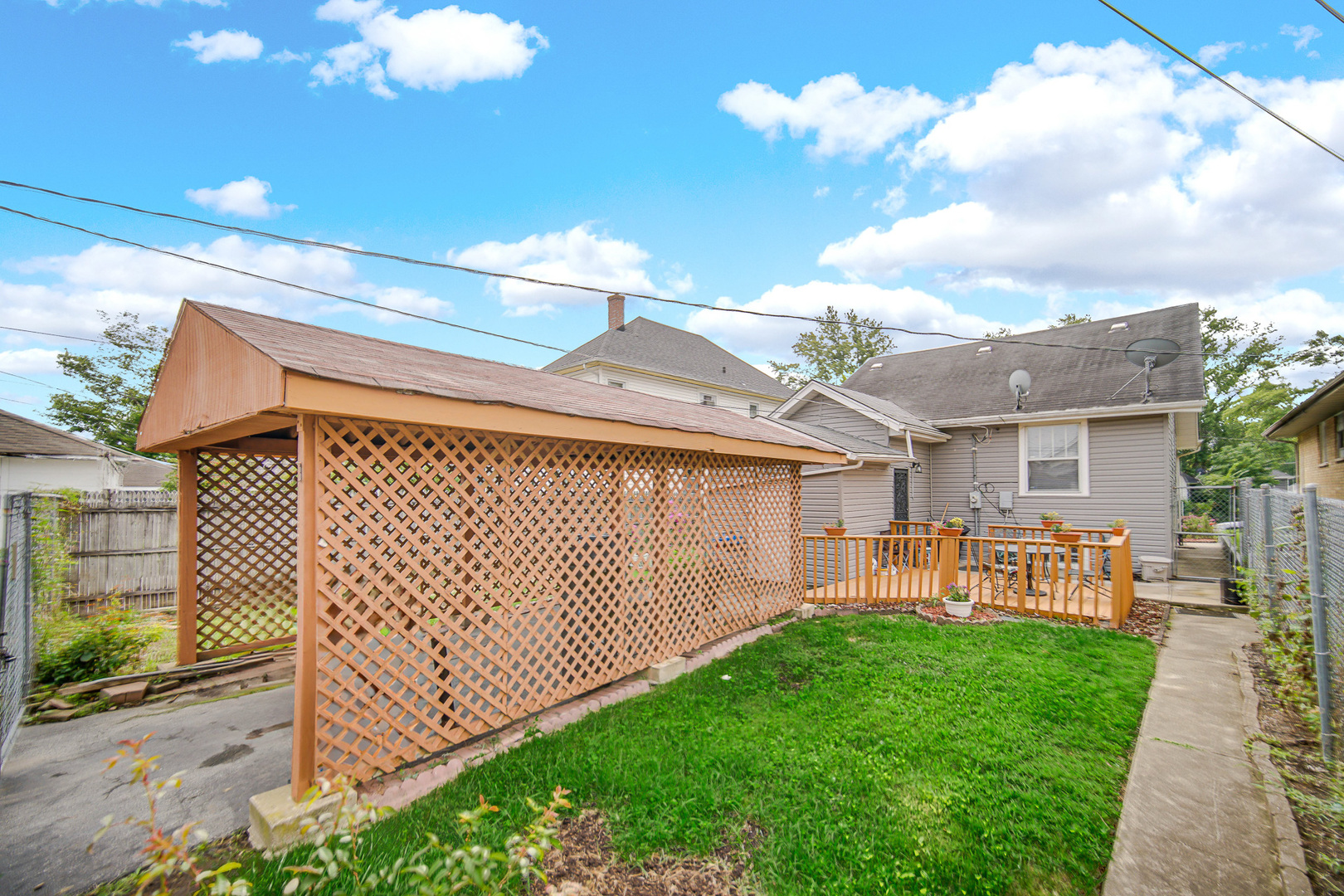 293 West 15th Street Chicago Heights, IL 60411 - Photo 14 of 16 a view of a house with a wooden fence