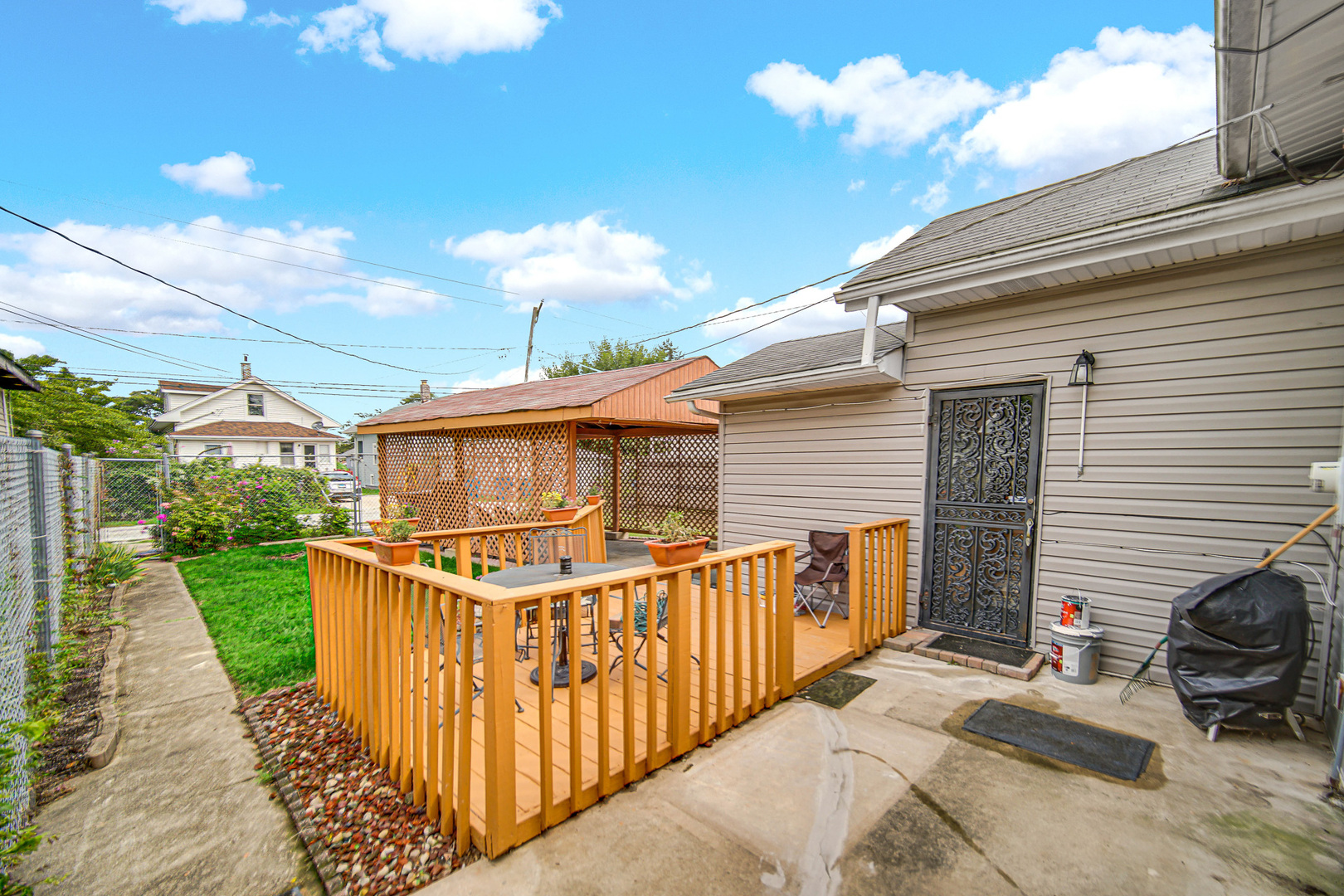 293 West 15th Street Chicago Heights, IL 60411 - Photo 15 of 16 a view of a house with backyard and sitting area