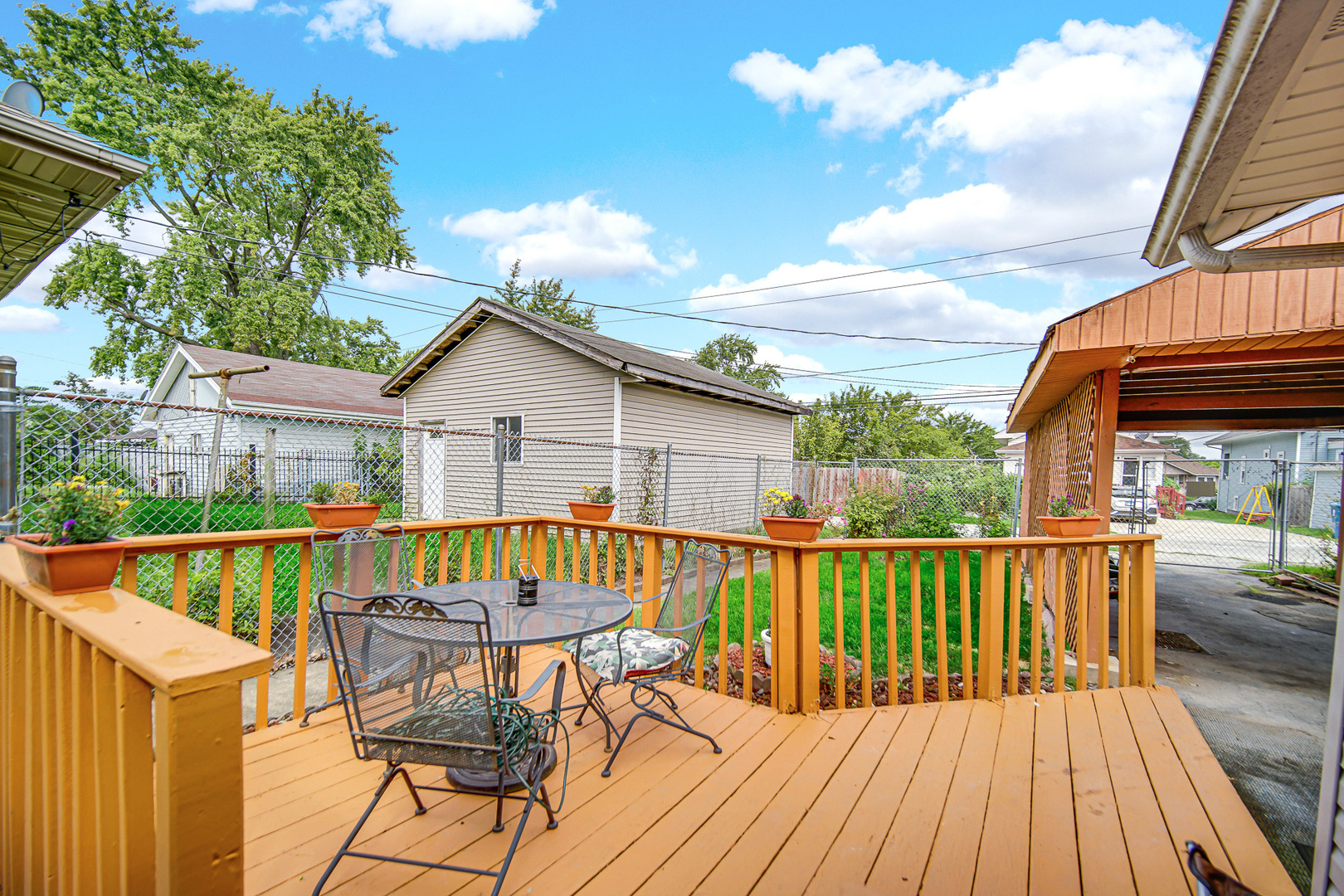 293 West 15th Street Chicago Heights, IL 60411 - Photo 16 of 16 a view of a house with wooden deck and furniture