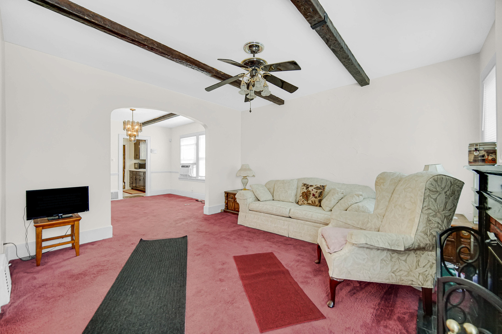 293 West 15th Street Chicago Heights, IL 60411 - Photo 3 of 16 a living room with furniture and a flat screen tv
