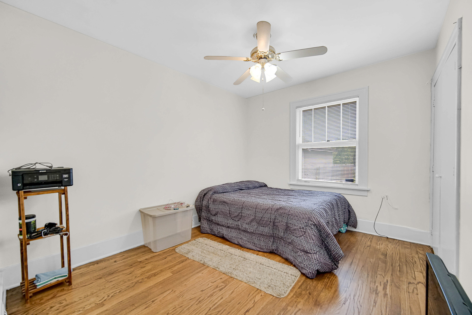 293 West 15th Street Chicago Heights, IL 60411 - Photo 10 of 16 a bedroom with a bed and a chandelier