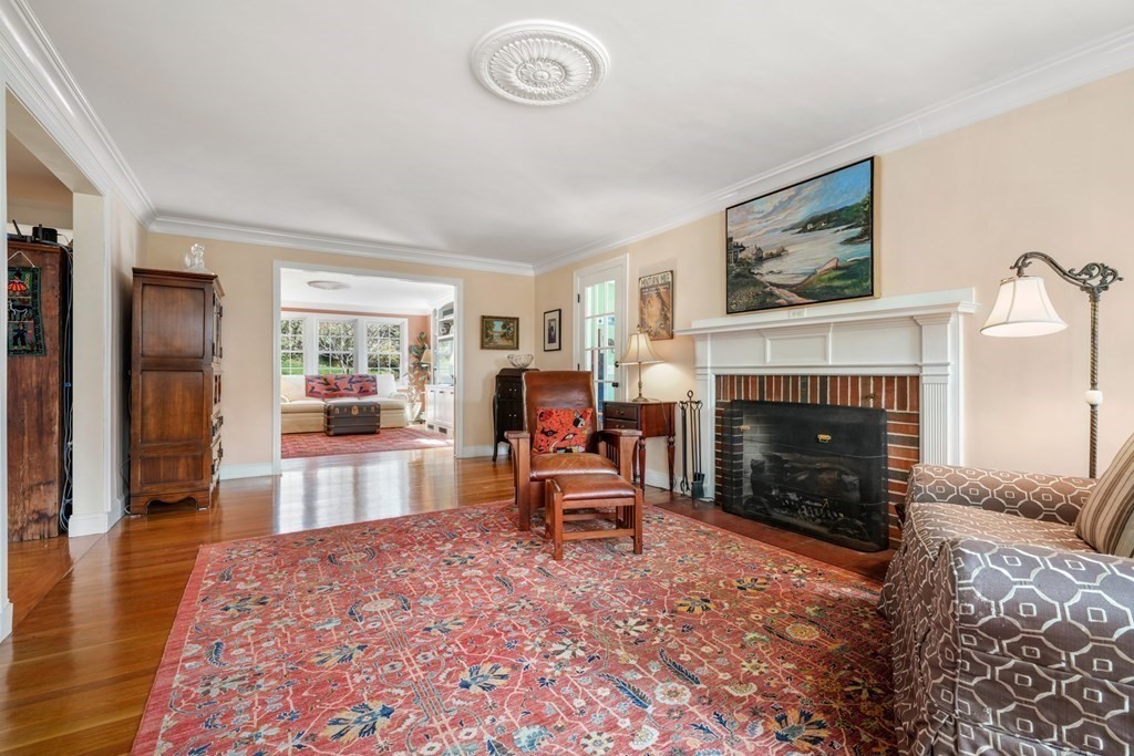 31 Malcolm Road Boston, MA 02130 - Photo 20 of 35 a living room with furniture and a fireplace