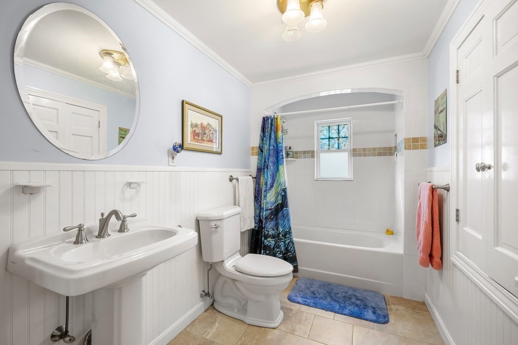 31 Malcolm Road Boston, MA 02130 - Photo 26 of 35 a bathroom with a toilet a sink and a mirror