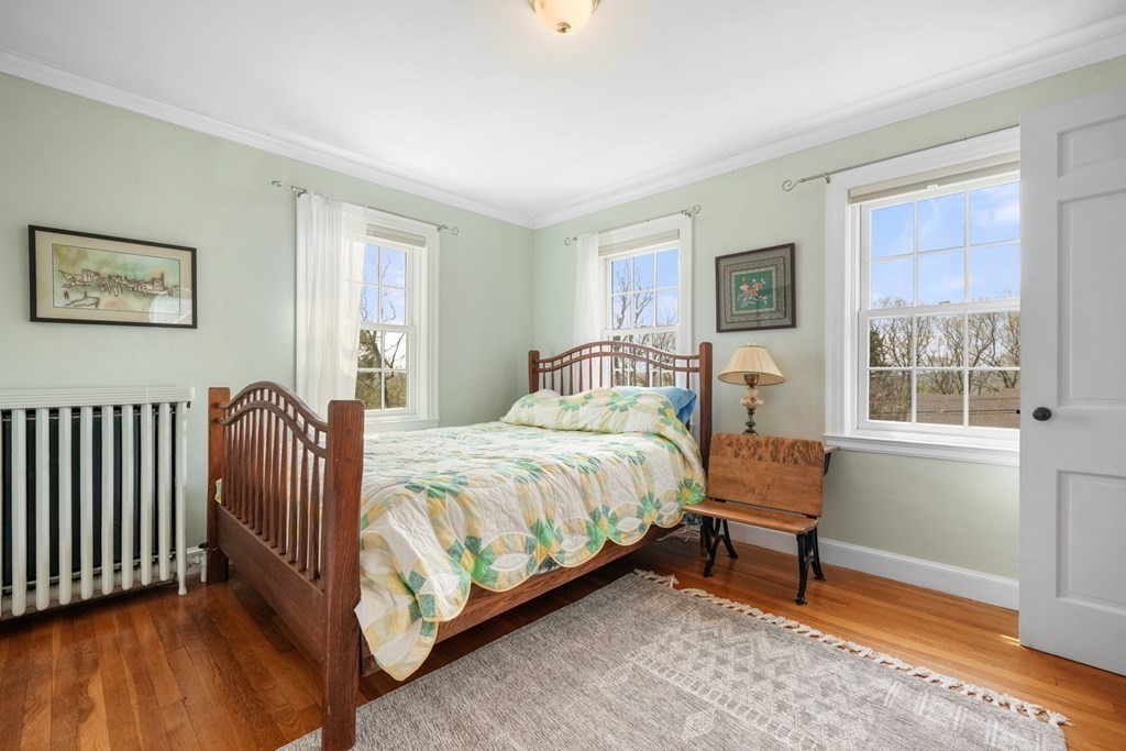 31 Malcolm Road Boston, MA 02130 - Photo 29 of 35 a bedroom with a bed and a window