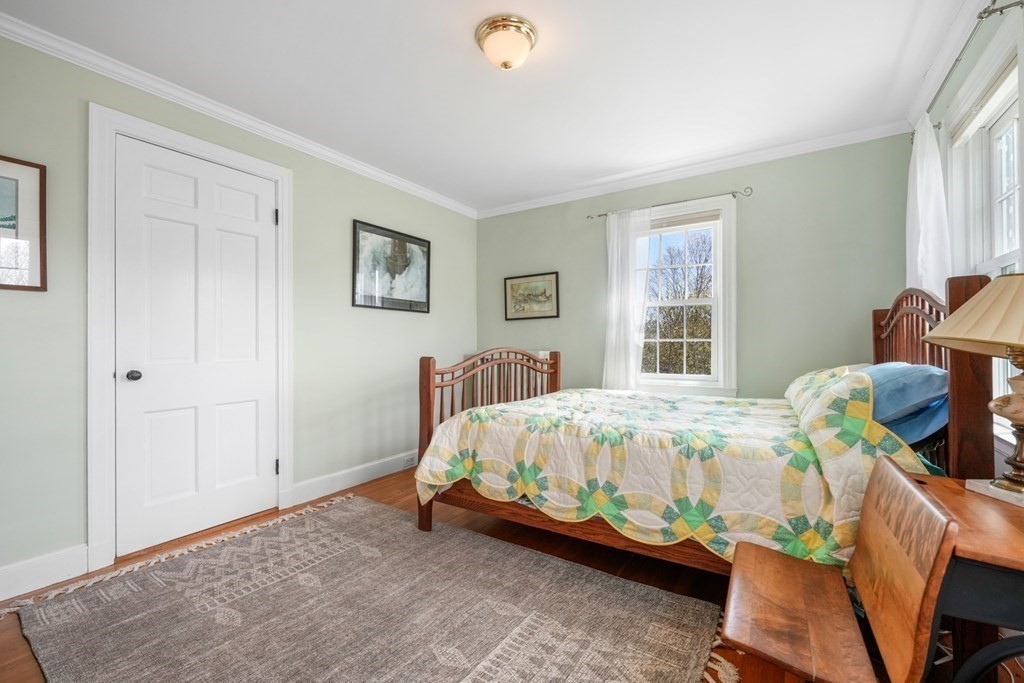 31 Malcolm Road Boston, MA 02130 - Photo 30 of 35 a bed sitting in a bedroom next to a window