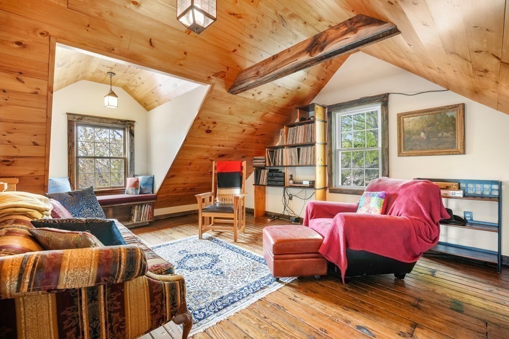 31 Malcolm Road Boston, MA 02130 - Photo 32 of 35 a bedroom with furniture and a wooden floor