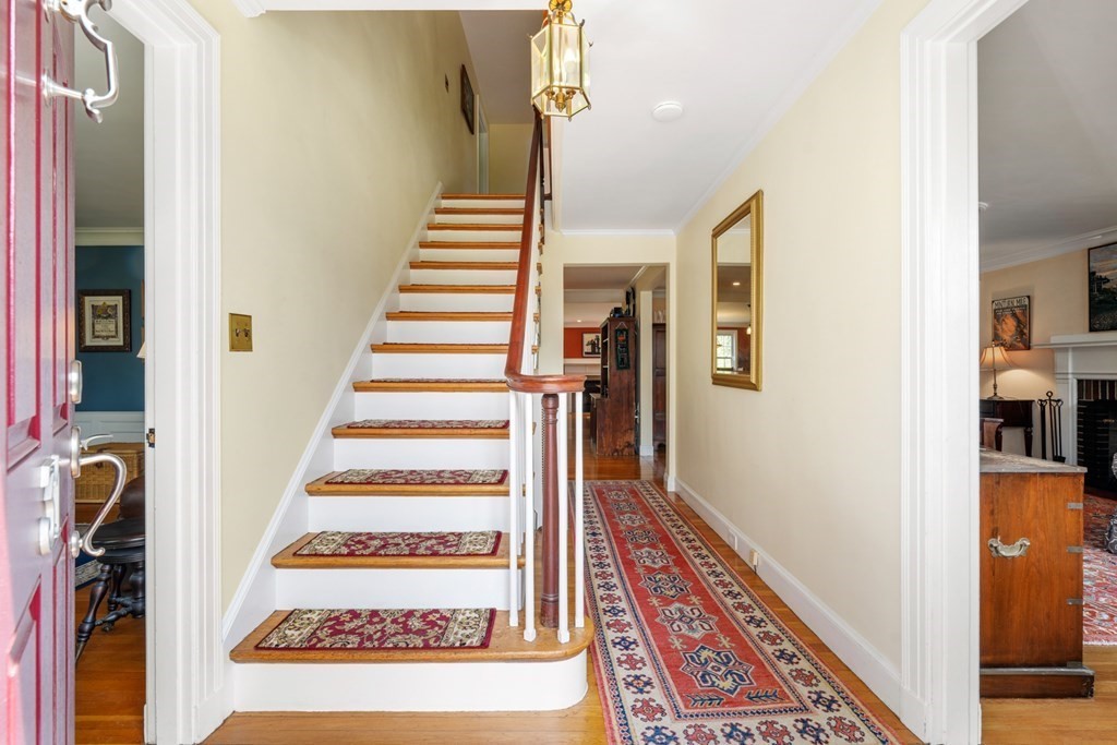 31 Malcolm Road Boston, MA 02130 - Photo 7 of 35 a view of a hallway with paintings on the wall