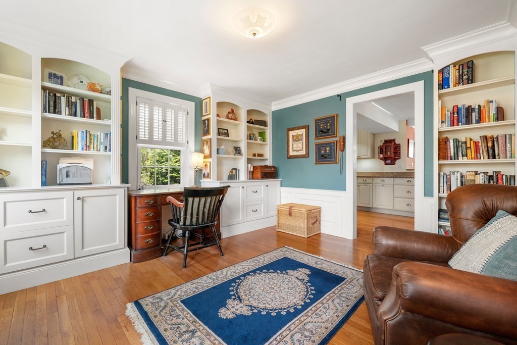 31 Malcolm Road Boston, MA 02130 - Photo 9 of 35 a living room with furniture a bookshelf and a window