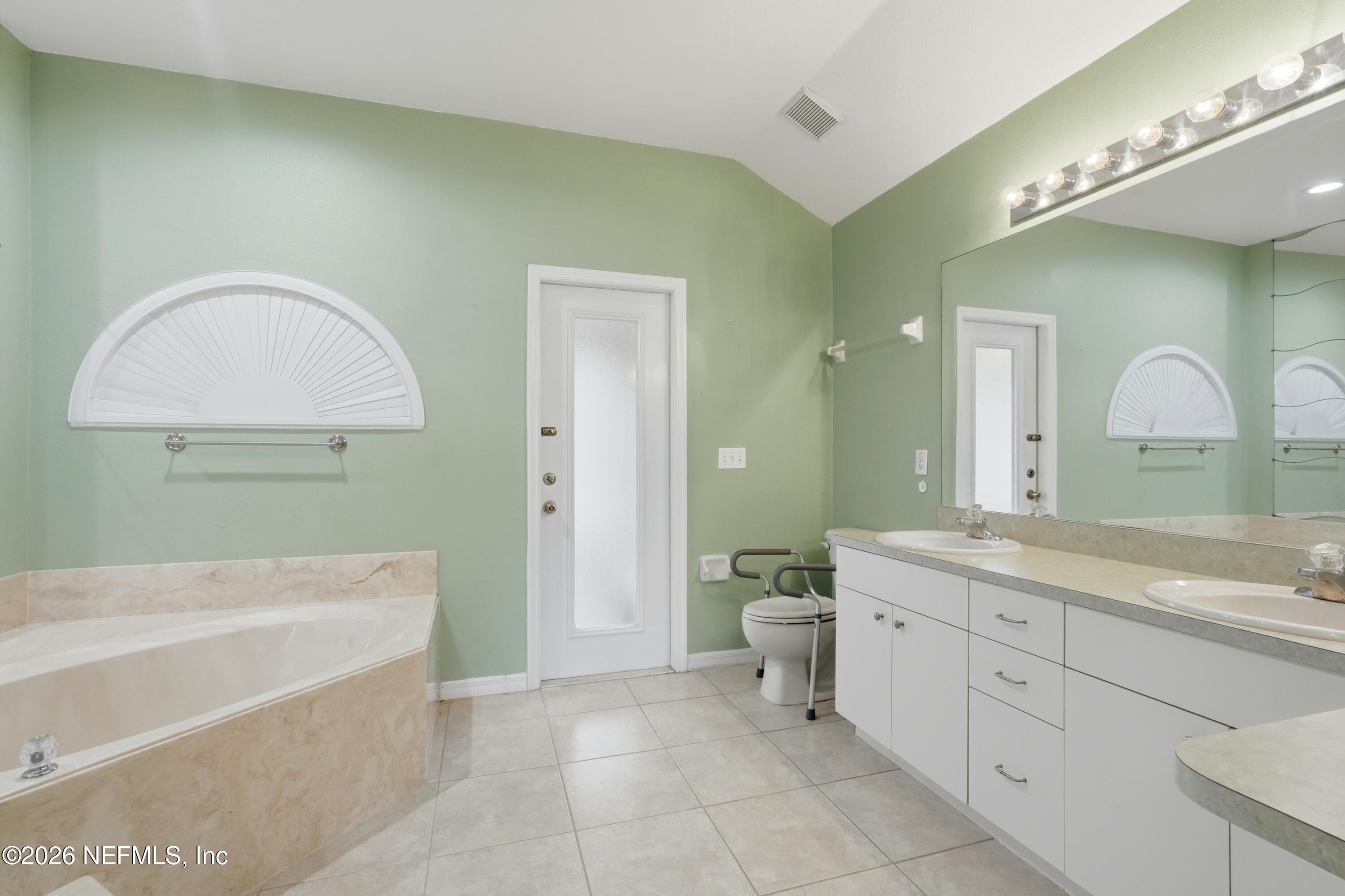 2270 Carson Lane Deltona, FL 32738 - Photo 15 of 24 a spacious bathroom with a tub sink and mirror