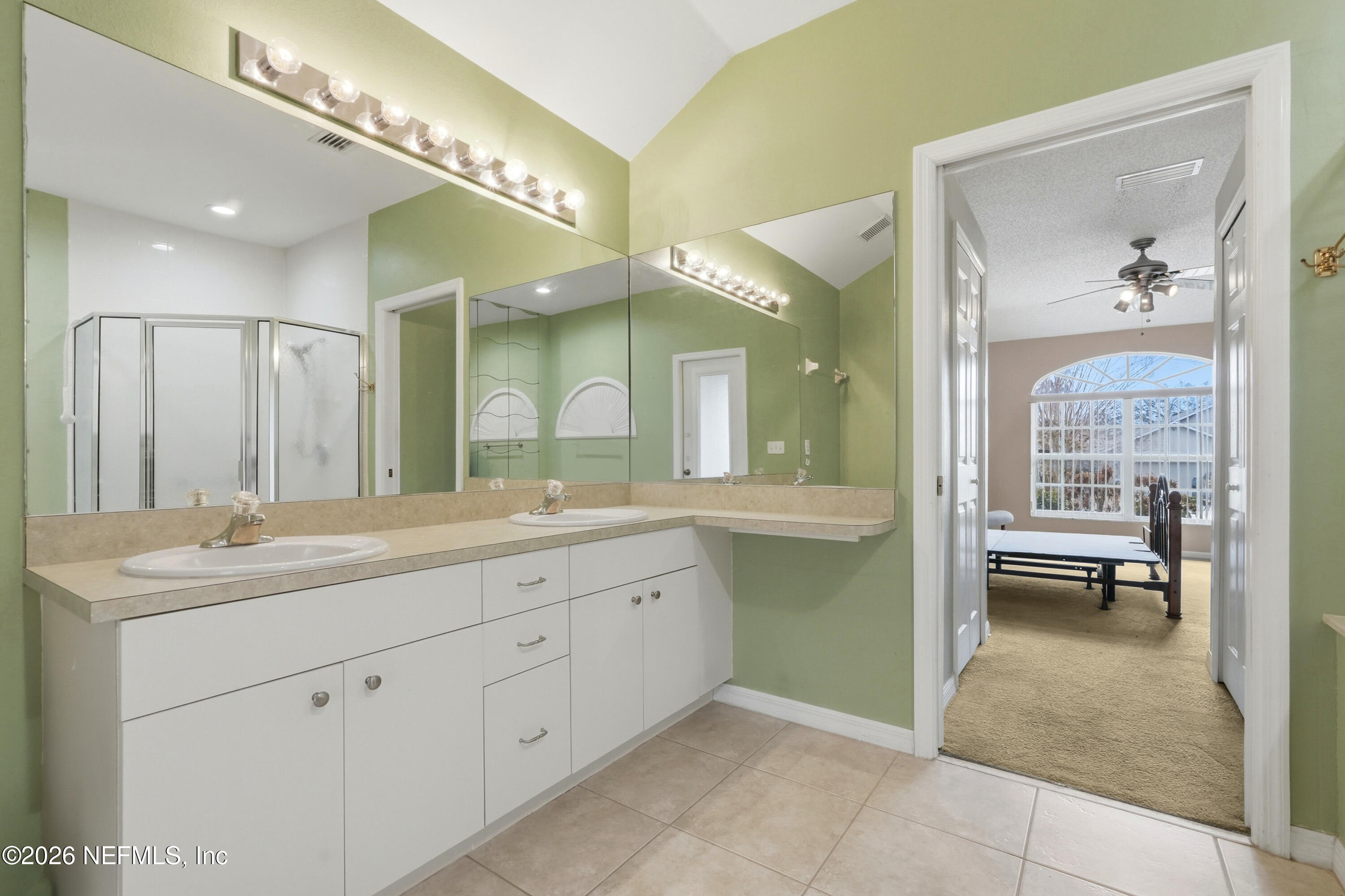 2270 Carson Lane Deltona, FL 32738 - Photo 17 of 24 a spacious bathroom with a granite countertop sink a toilet and a mirror