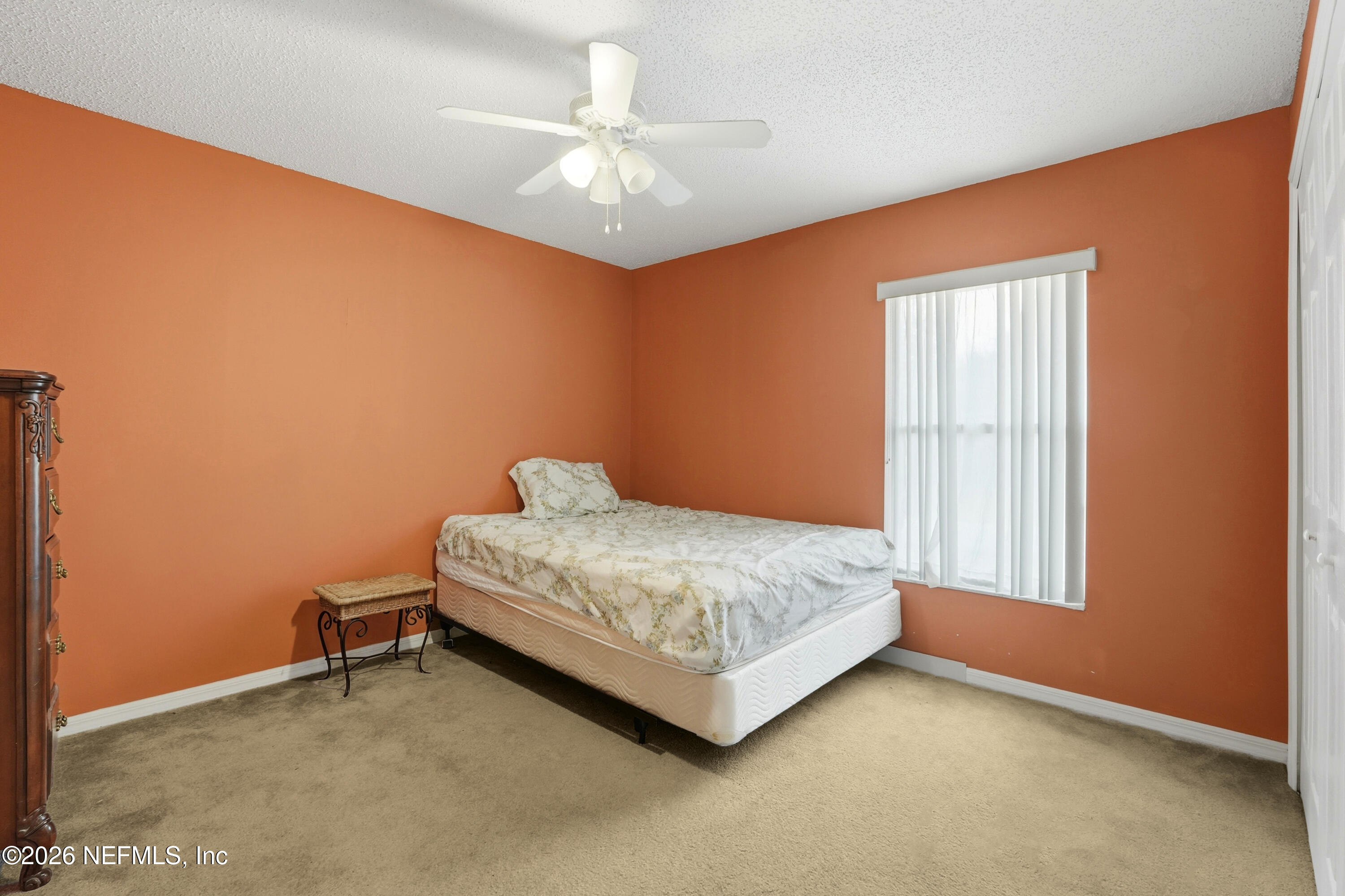 2270 Carson Lane Deltona, FL 32738 - Photo 19 of 24 a bedroom with a bed and a chandelier