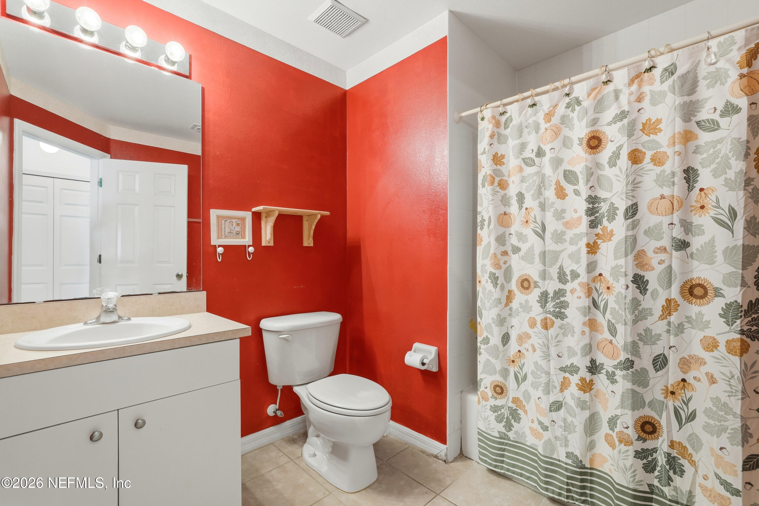 2270 Carson Lane Deltona, FL 32738 - Photo 20 of 24 a bathroom with a toilet a sink and a mirror