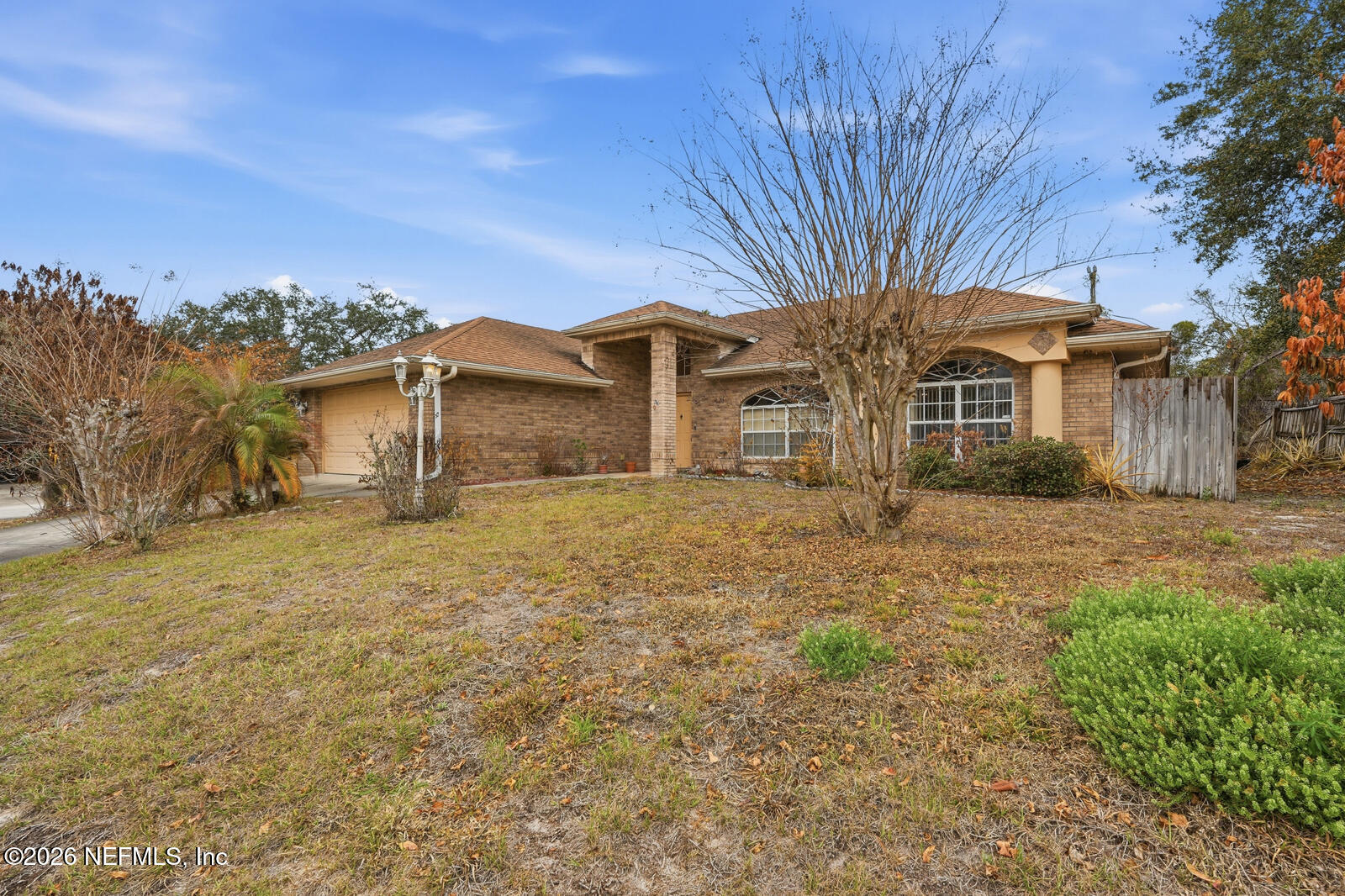2270 Carson Lane Deltona, FL 32738 - Photo 2 of 24 a front view of a house with a garden