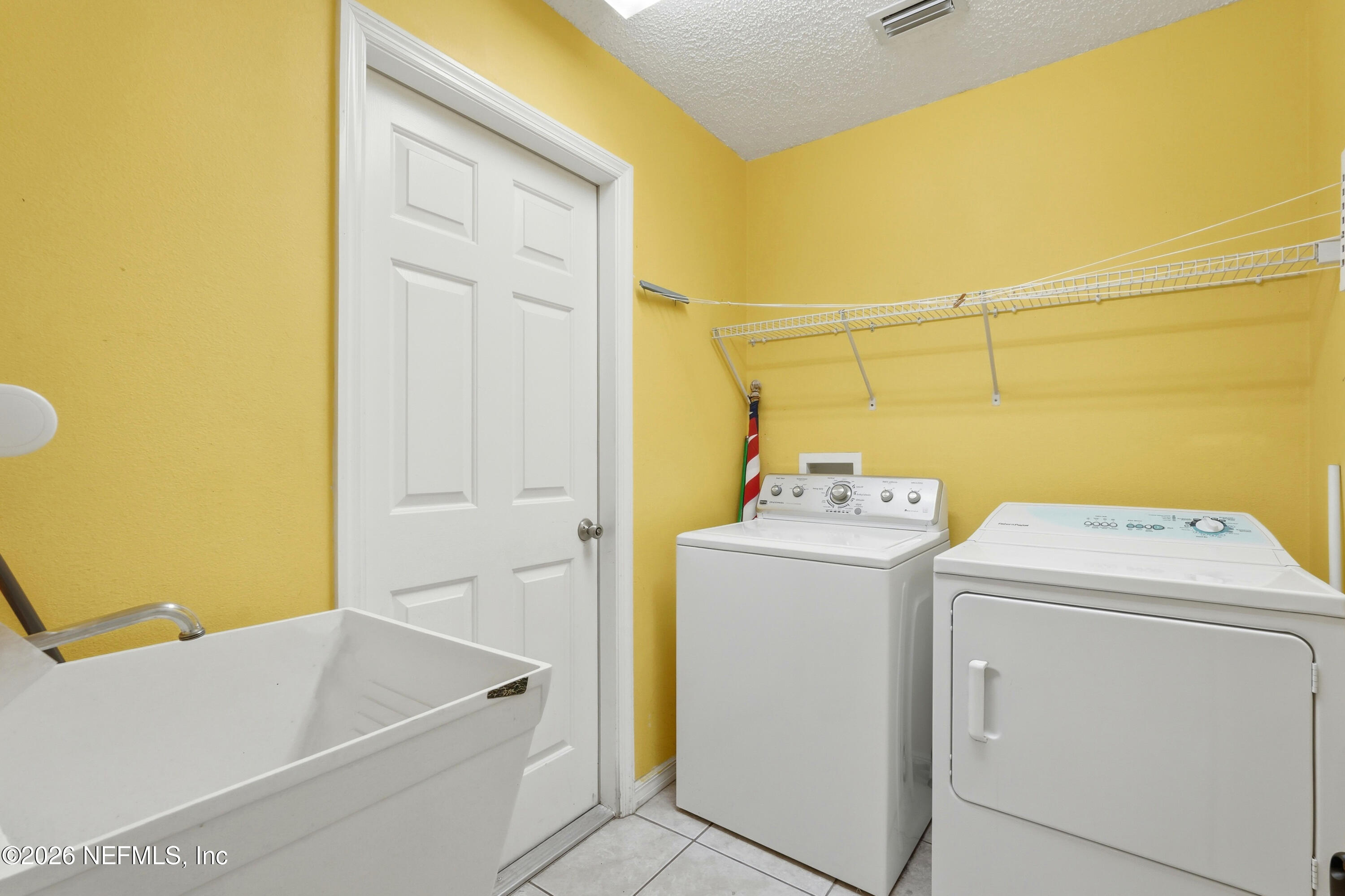 2270 Carson Lane Deltona, FL 32738 - Photo 21 of 24 a utility room with dryer and washer