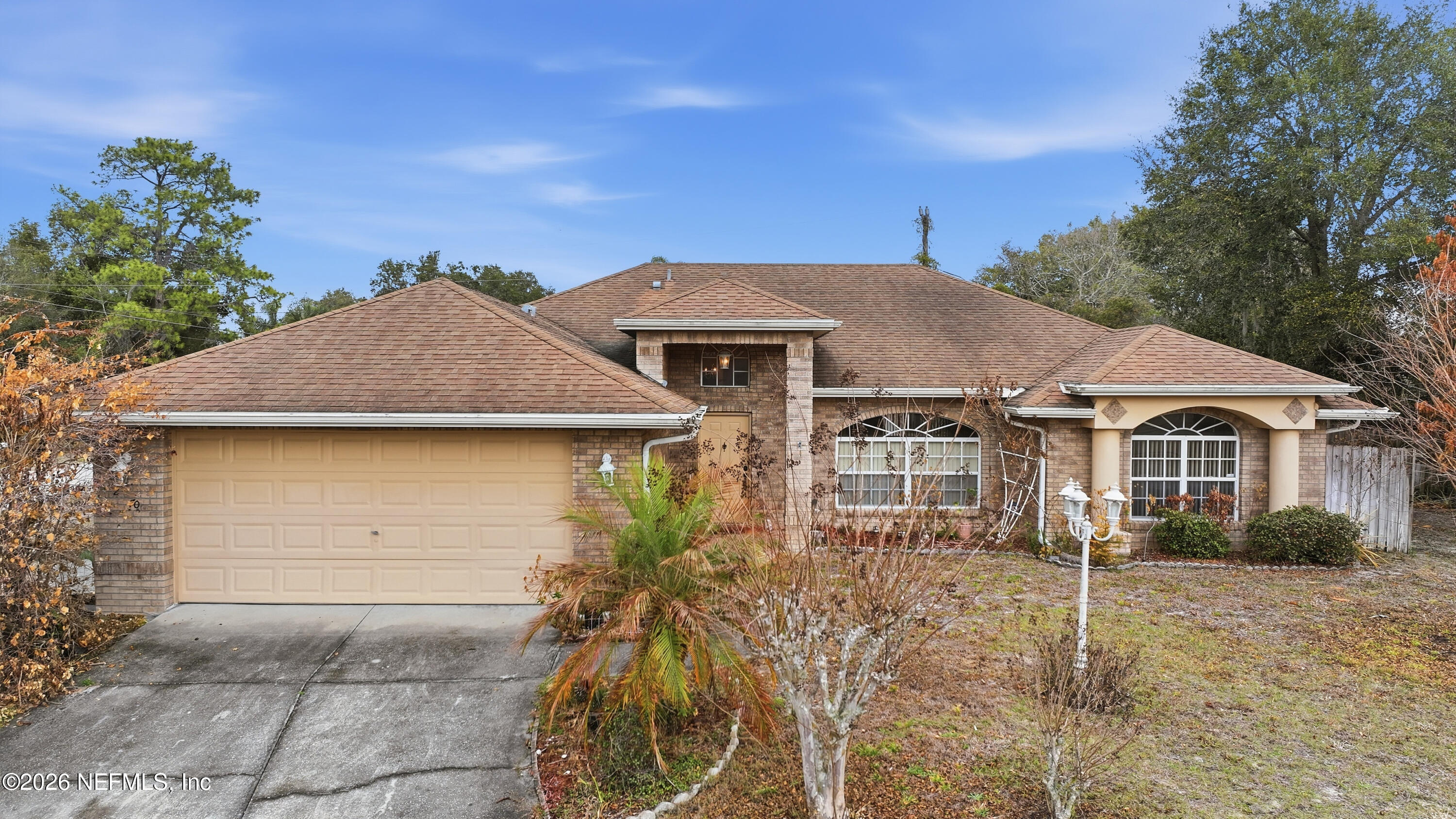 2270 Carson Lane Deltona, FL 32738 - Photo 3 of 24 front view of a house with a yard