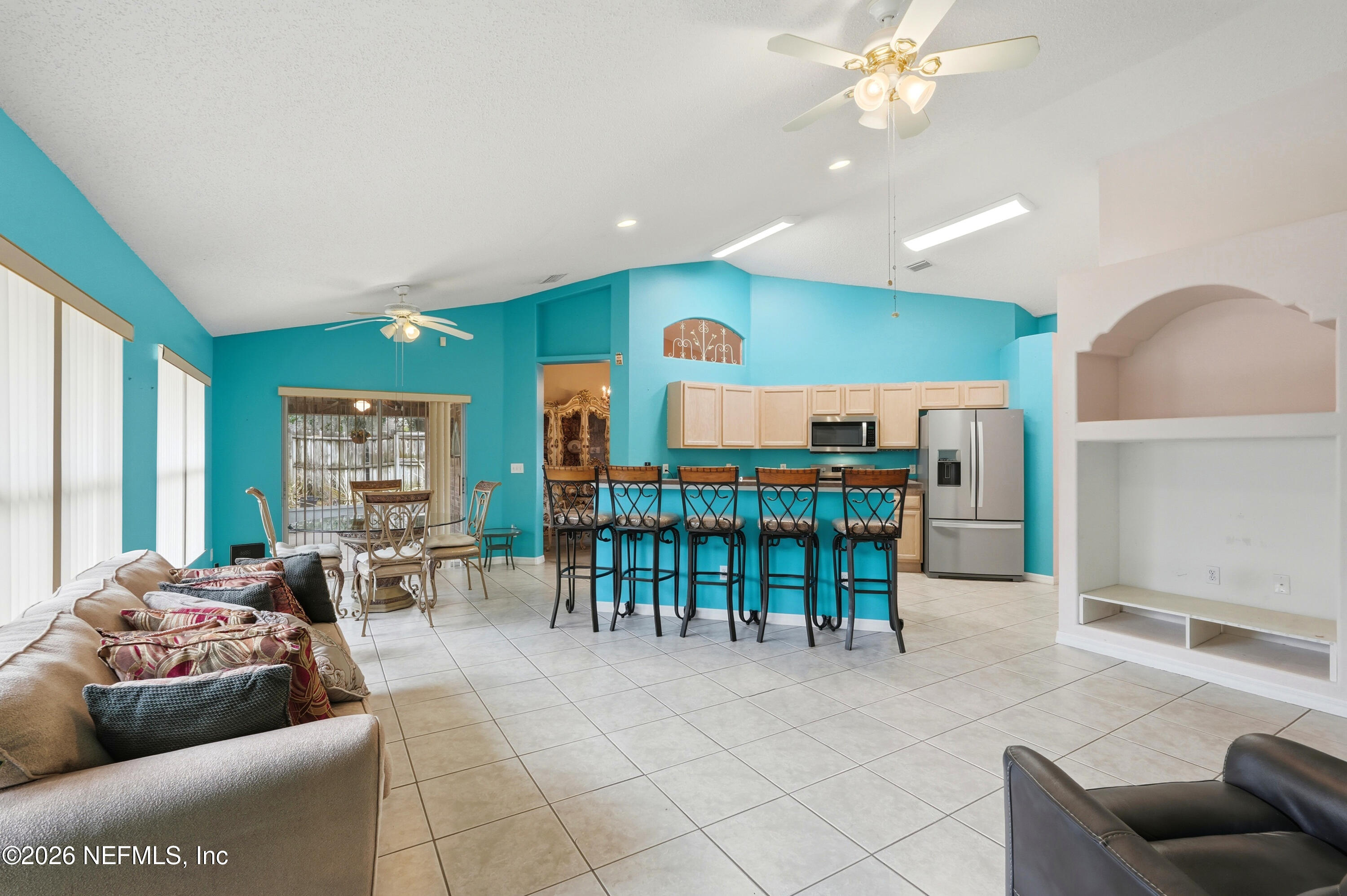 2270 Carson Lane Deltona, FL 32738 - Photo 6 of 24 a living room with furniture and a chandelier