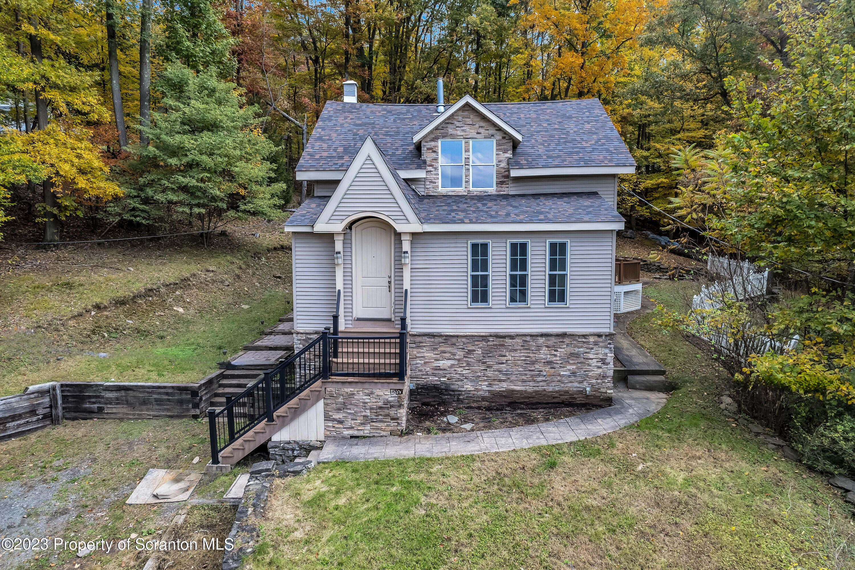 21 Ridge Street Dallas, PA 18612 - Photo 1 of 92 a front view of a house with garden
