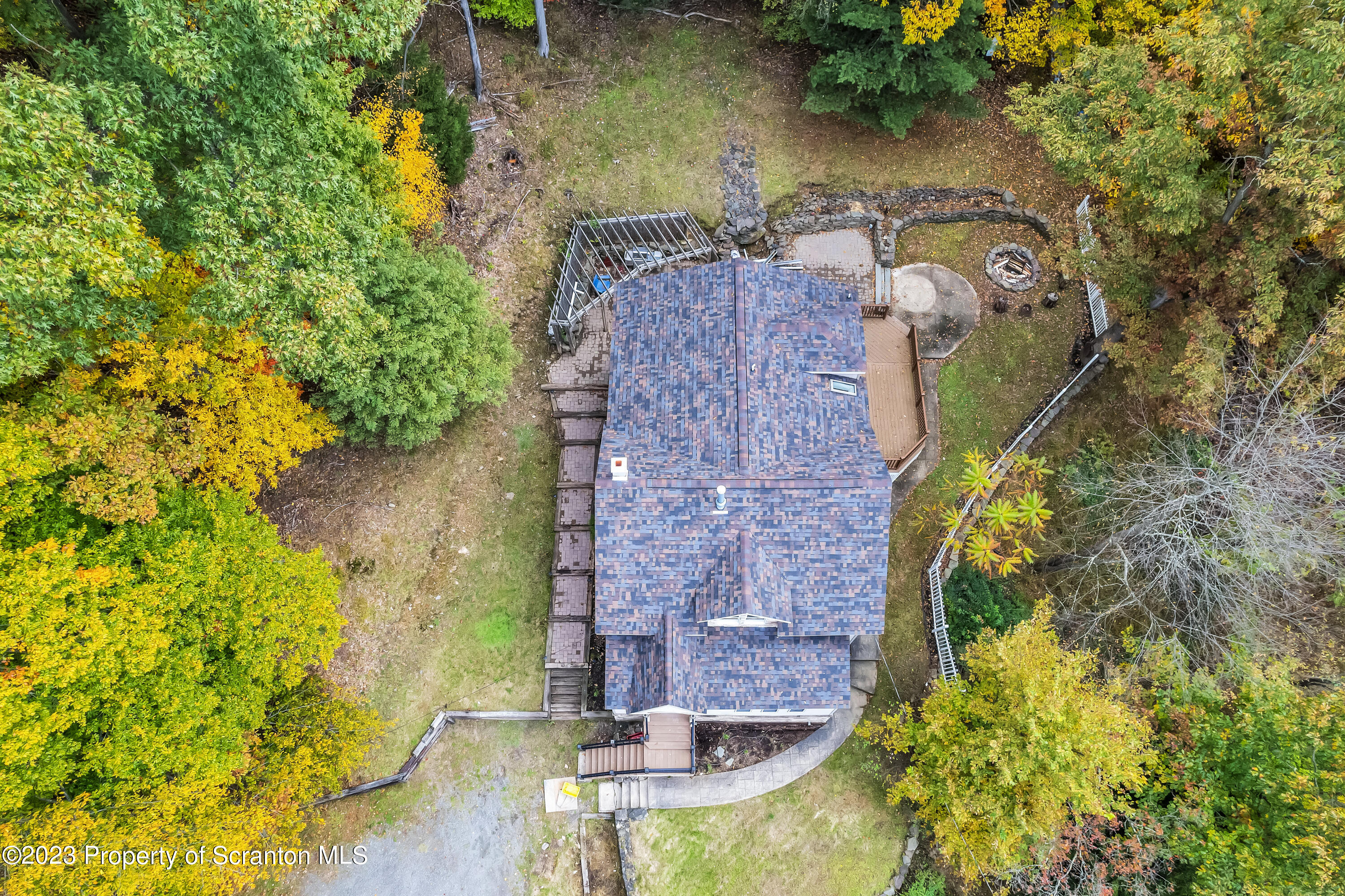 21 Ridge Street Dallas, PA 18612 - Photo 3 of 92 an aerial view of a house with a yard swimming pool and outdoor seating