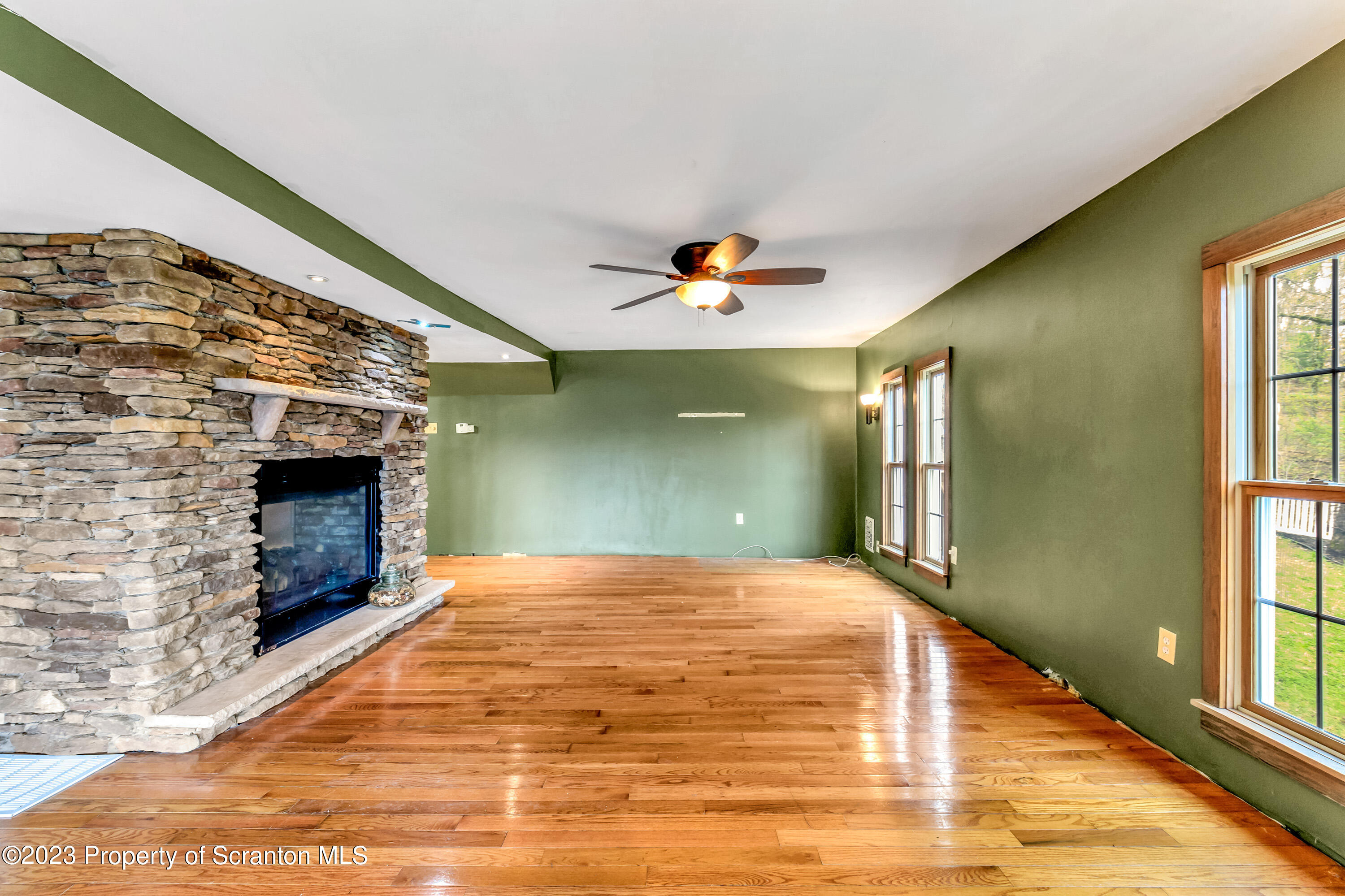 21 Ridge Street Dallas, PA 18612 - Photo 48 of 92 a view of a livingroom with a fireplace and window