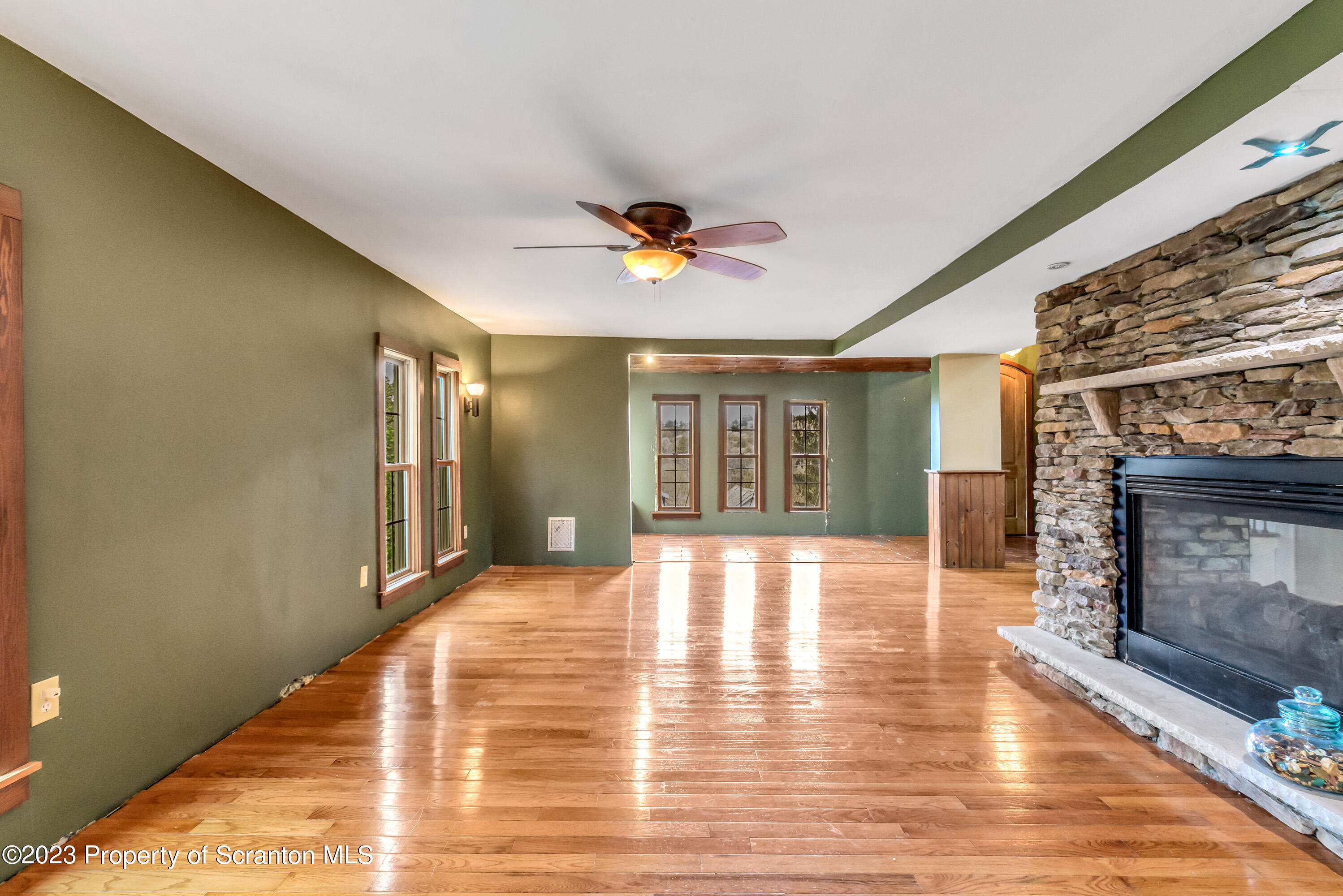 21 Ridge Street Dallas, PA 18612 - Photo 49 of 92 a view of an empty room with window and wooden floor