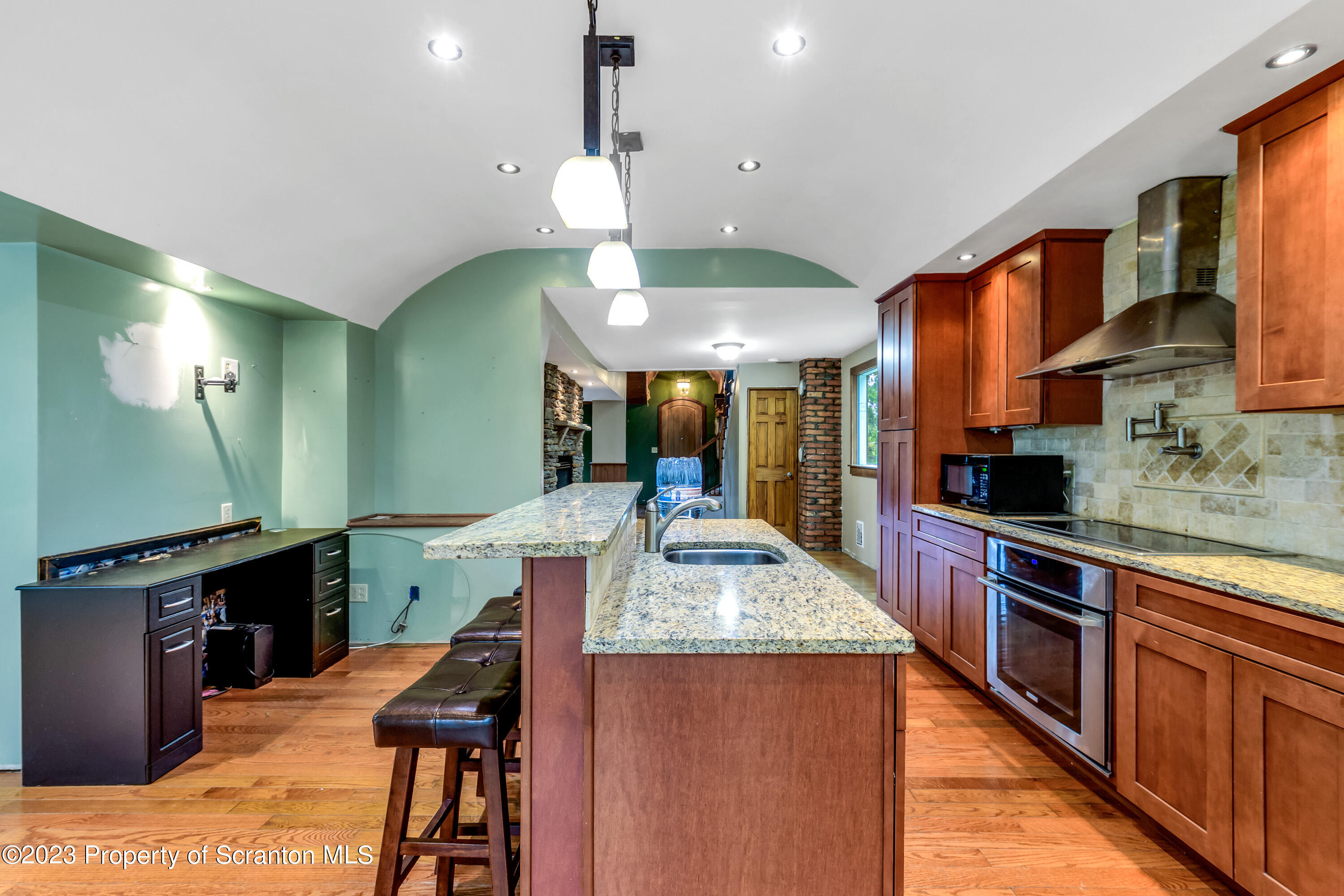 21 Ridge Street Dallas, PA 18612 - Photo 56 of 92 a kitchen with stainless steel appliances kitchen island granite countertop a sink and cabinets