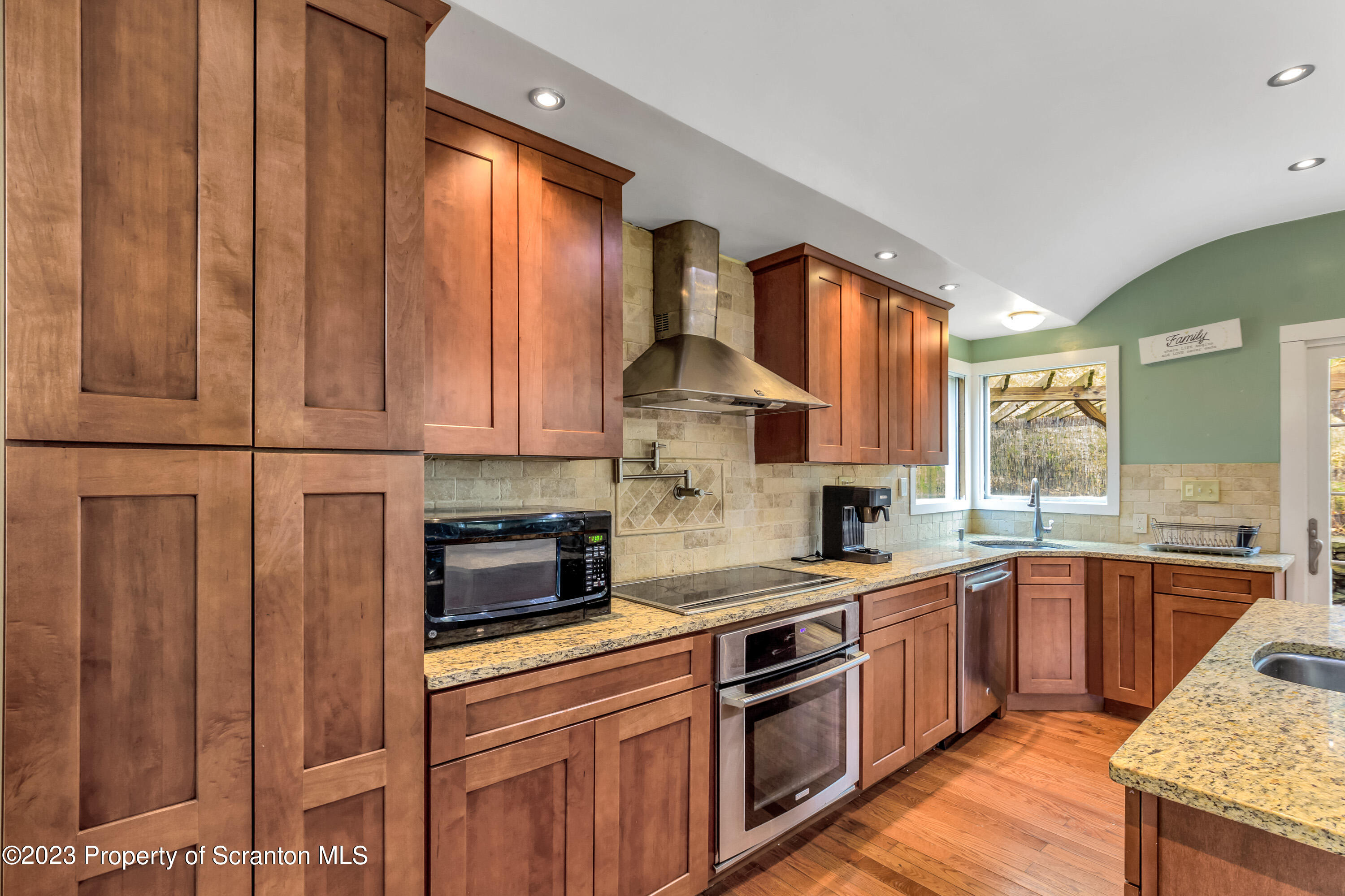 21 Ridge Street Dallas, PA 18612 - Photo 60 of 92 a kitchen with stainless steel appliances granite countertop wooden cabinets and a stove top oven