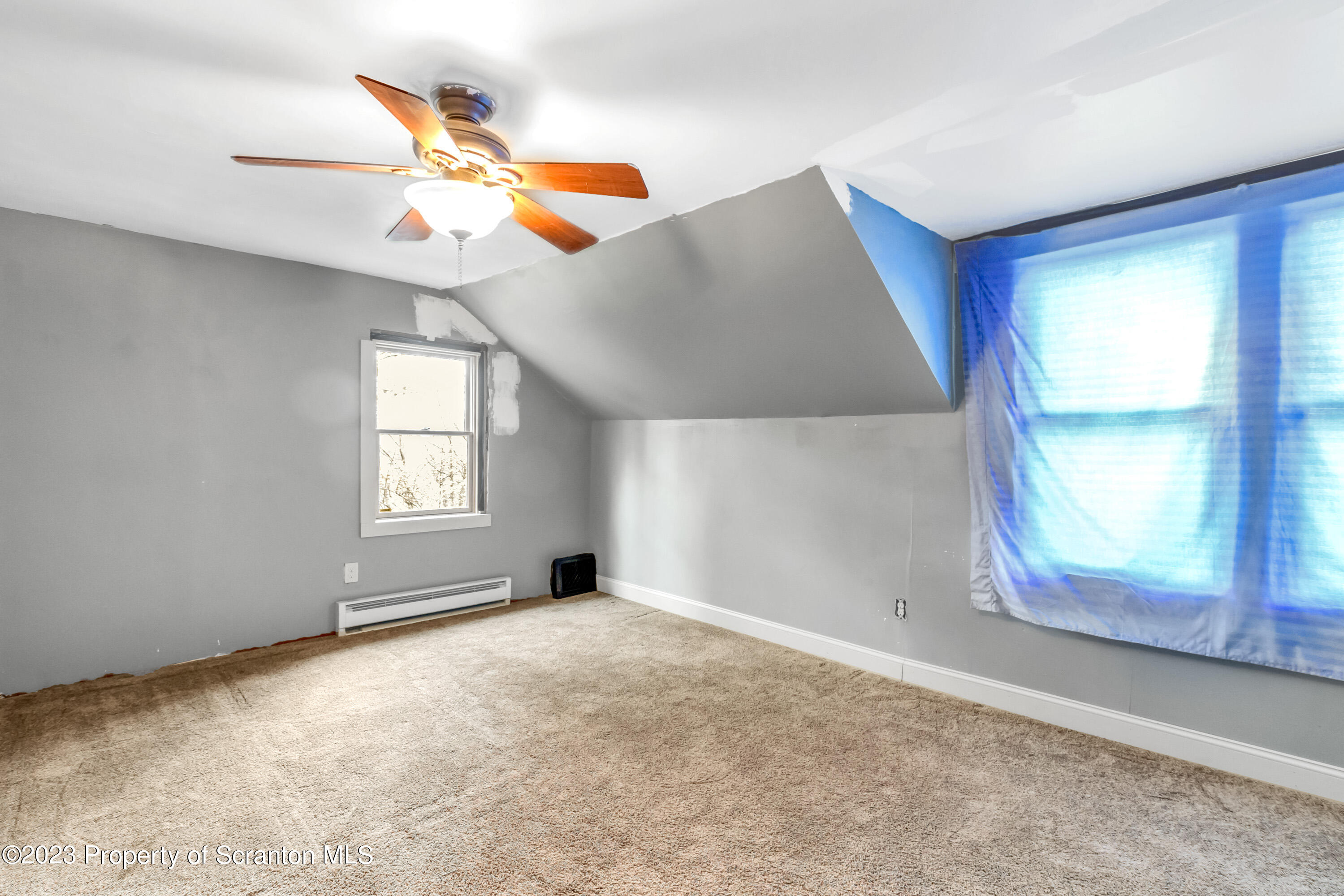 21 Ridge Street Dallas, PA 18612 - Photo 81 of 92 a view of an empty room with a window