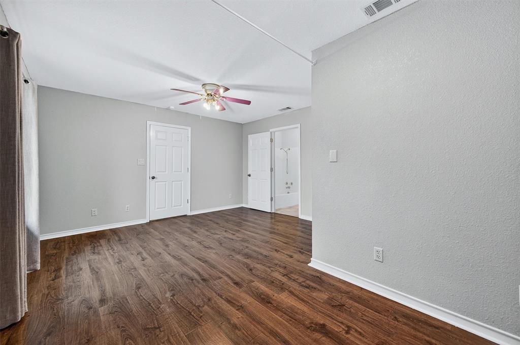 443 Lakewood Road Denison, TX 75020 - Photo 19 of 38 a view of an empty room and wooden floor