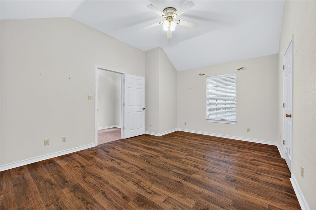 443 Lakewood Road Denison, TX 75020 - Photo 27 of 38 wooden floor in an empty room with a window