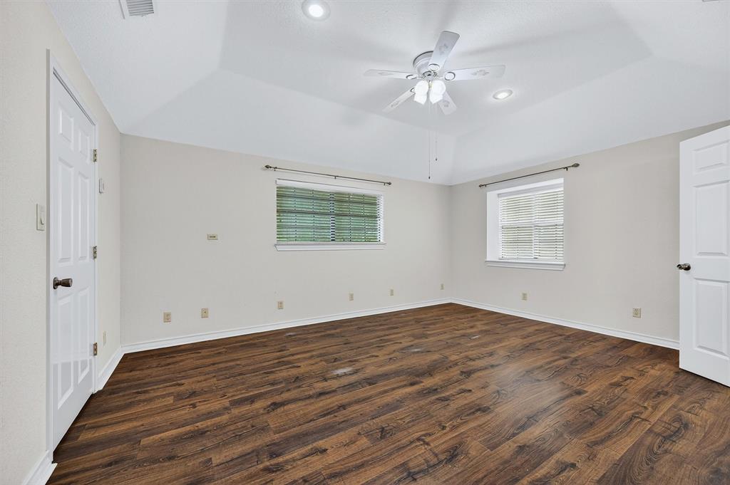 443 Lakewood Road Denison, TX 75020 - Photo 30 of 38 wooden floor in an empty room with a window