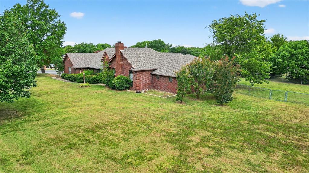443 Lakewood Road Denison, TX 75020 - Photo 4 of 38 an aerial view of a house