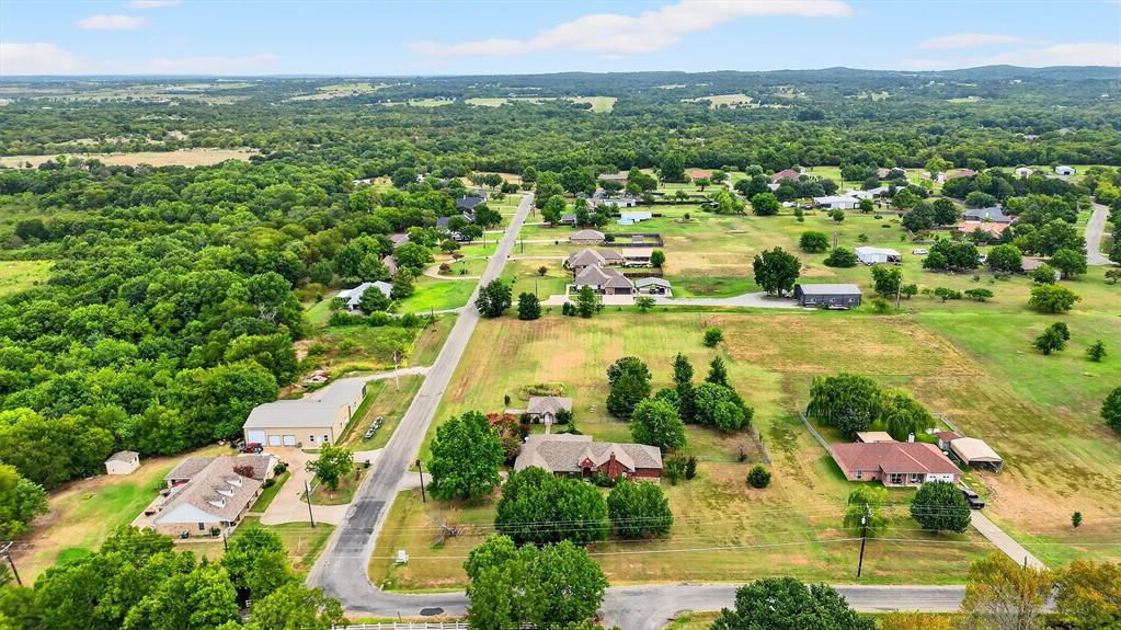 443 Lakewood Road Denison, TX 75020 - Photo 6 of 38 an aerial view of residential houses with outdoor space and trees