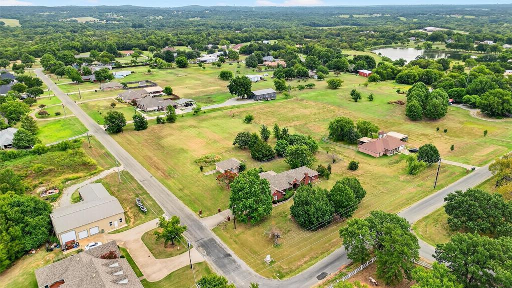 443 Lakewood Road Denison, TX 75020 - Photo 7 of 38 an aerial view of residential houses with outdoor space