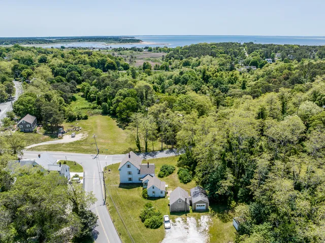 an aerial view of a house with a yard