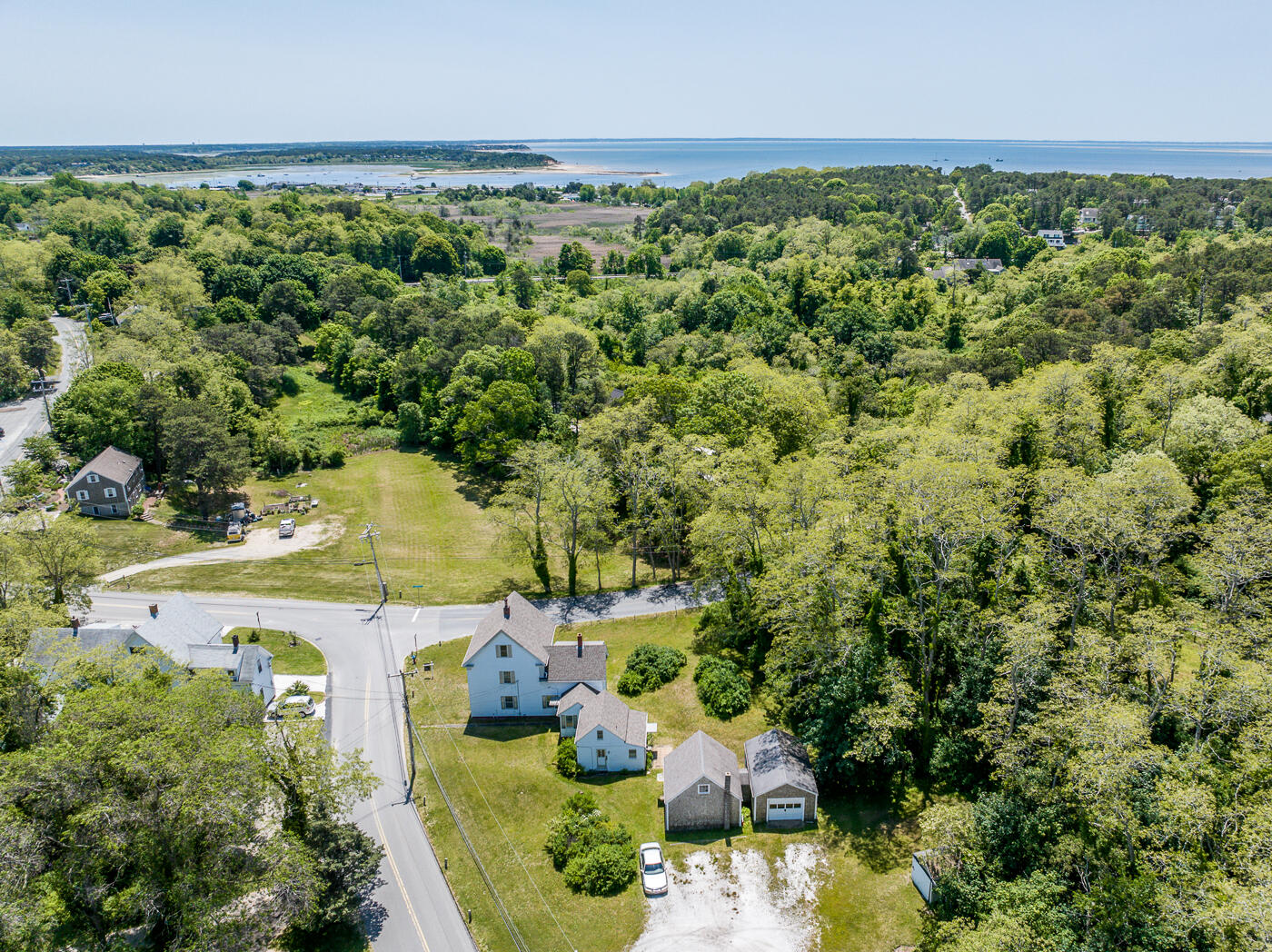 an aerial view of a house with a yard