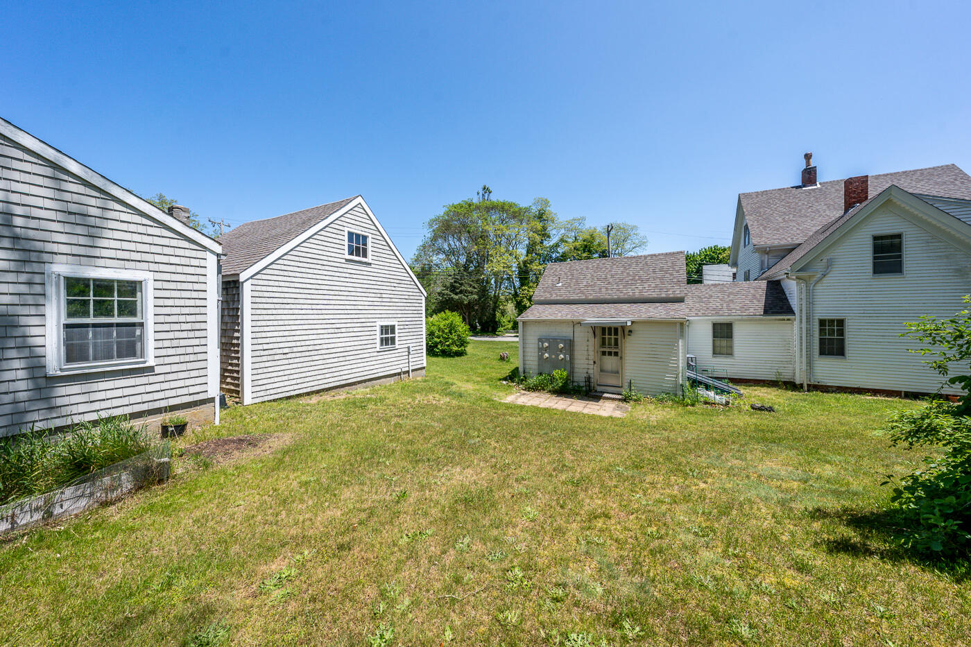 105 West Main Street Wellfleet, MA 02667 - Photo 14 of 59 a view of a house with a backyard
