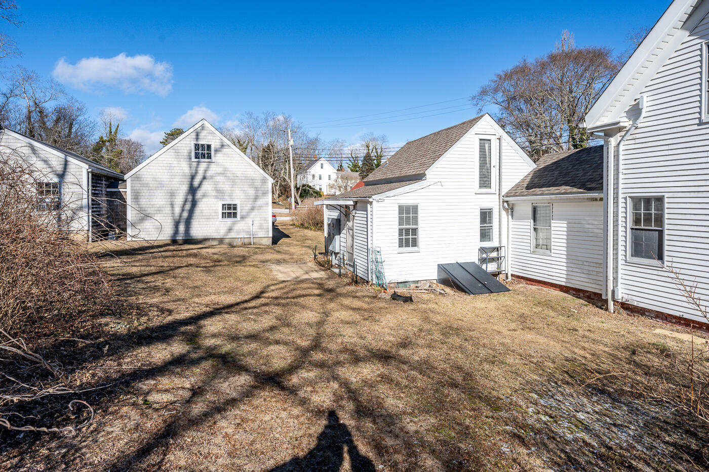 105 West Main Street Wellfleet, MA 02667 - Photo 18 of 59 a view of a house with a snow in the yard