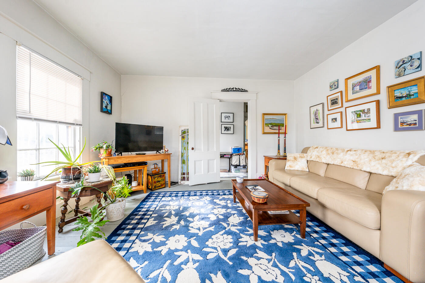 105 West Main Street Wellfleet, MA 02667 - Photo 25 of 59 a living room with furniture and a flat screen tv