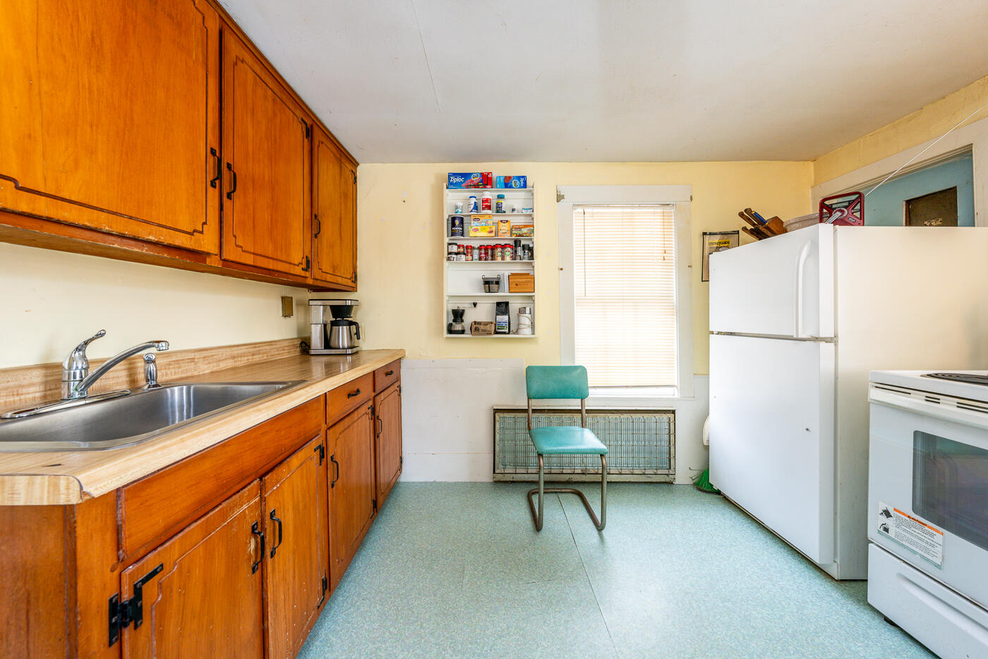 105 West Main Street Wellfleet, MA 02667 - Photo 39 of 59 a kitchen with refrigerator cabinets and a sink