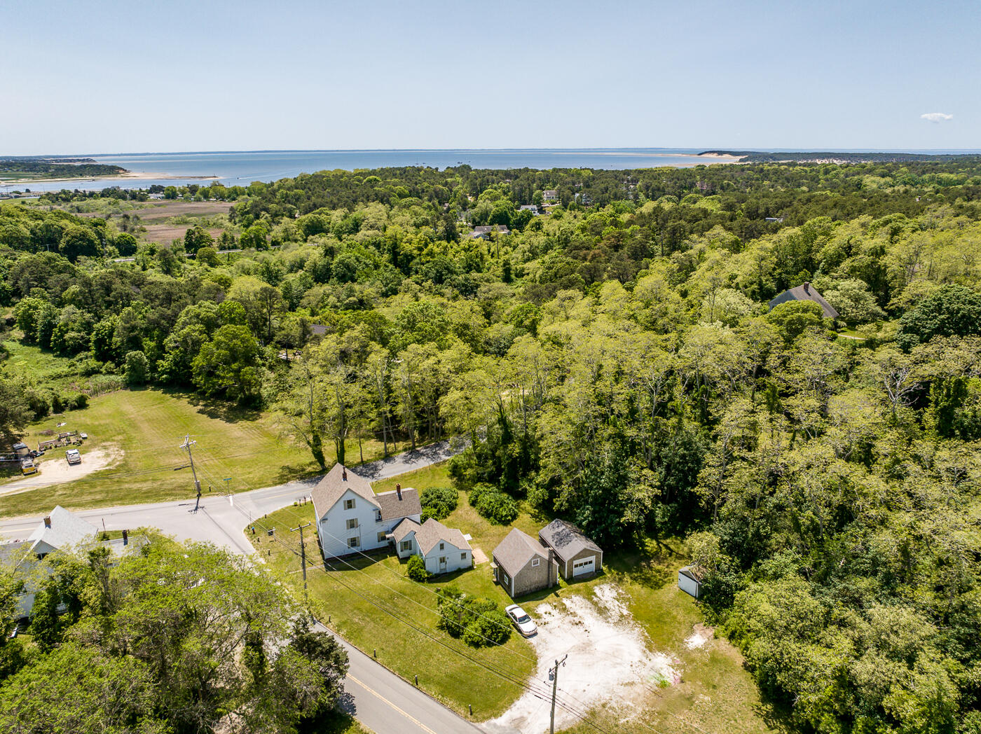 105 West Main Street Wellfleet, MA 02667 - Photo 4 of 59 a view of a yard with an outdoor seating and lake view