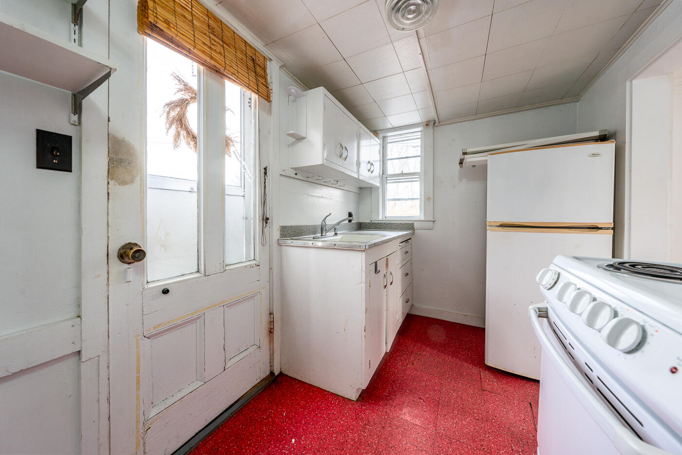 105 West Main Street Wellfleet, MA 02667 - Photo 47 of 59 a kitchen with stainless steel appliances granite countertop a sink a stove a refrigerator a oven with white cabinets and wooden floor