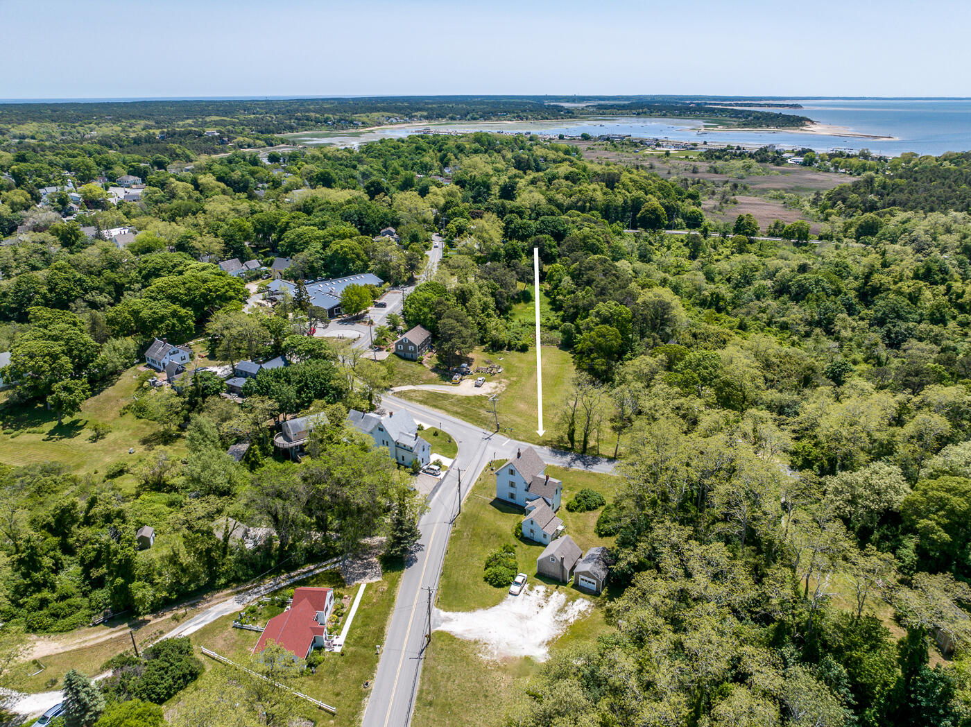 105 West Main Street Wellfleet, MA 02667 - Photo 5 of 59 an aerial view of residential houses with outdoor space and trees