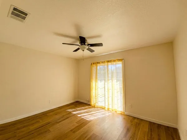 a view of an empty room and window