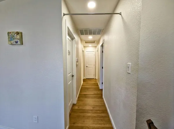 a view of a hallway with a glass door